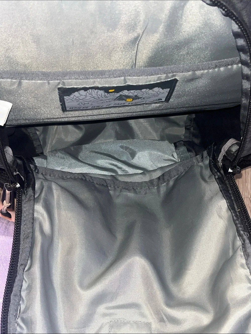 The NorthFace Jester Black Backpack with Light Pink Bungee Cord